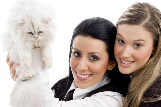 young woman holding her pet cat and looking at camera with white background