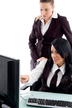executive indicating towards computer in office