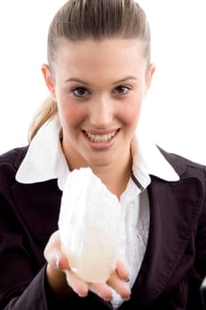 young executive holding rock with white background