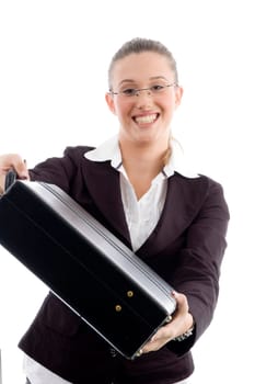 smiling woman showing briefcase against white background