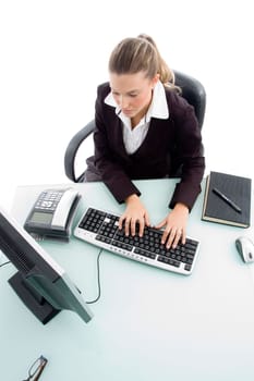 high angle view of woman working on computer on an isolated white background