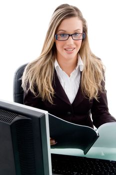 young female sitting in office against white background