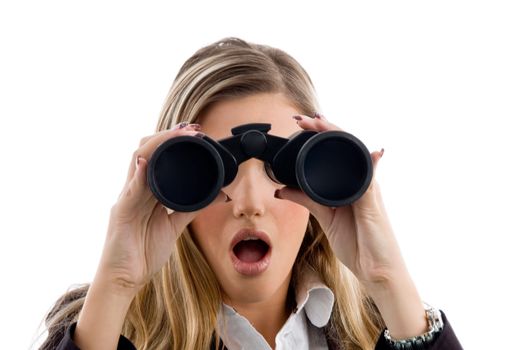woman looking through binocular against white background