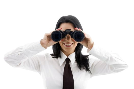 young businesswoman looking through binocular against white background