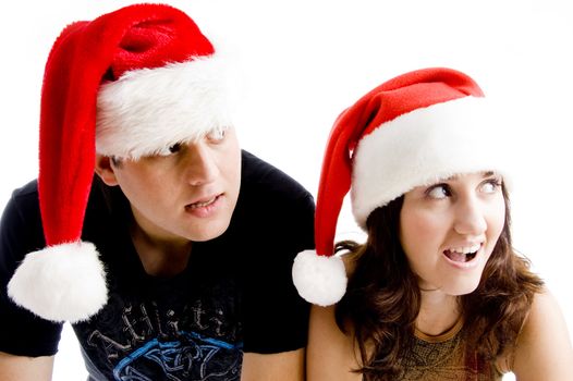 portrait of young couple wearing christmas hat with white background