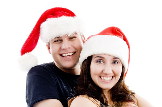 portrait of pleased couple with christmas hat on an isolated white background