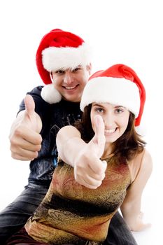 people with christmas hat showing thumbs up on an isolated background