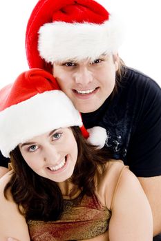 close view of young couple with christmas hat on an isolated white background