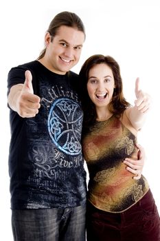 pointing couple looking at camera on an isolated background