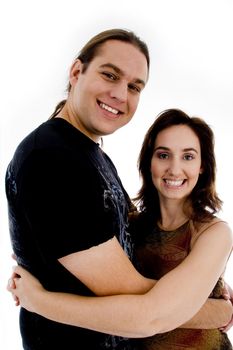 smiling playful young couple on an isolated white background