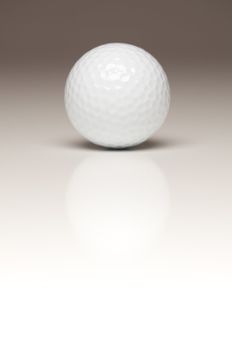 Single White Golf Ball on a Gradated White Background.