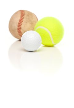 Baseball, Tennis and Golf Ball Isolated on a White Reflective Background.