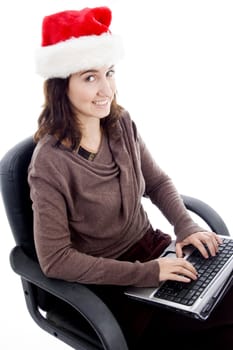 young female working on laptop on an isolated white background