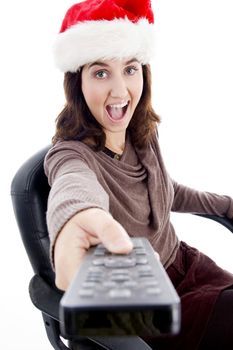 woman in christmas hat holding remote control solated on white background