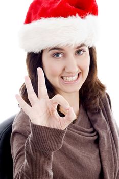 woman with ok hand gesture against white background