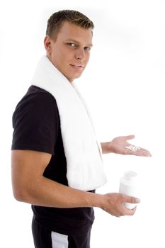 young man holding medicines on an  isolated white background