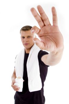 muscular male holding medicine on an isolated white background
