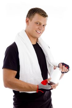 muscular male holding medicine bottle on an isolated white background