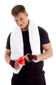 muscular male opening the cap of water bottle with white background