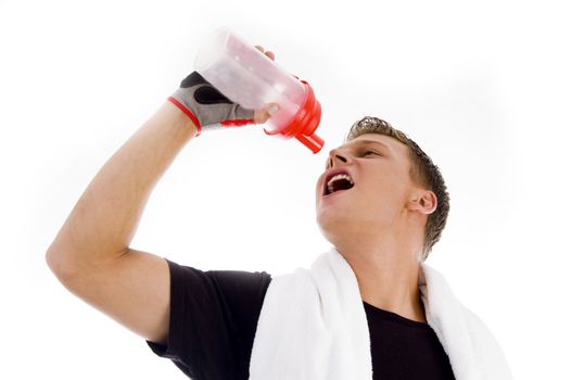 muscular man posing with water bottle on an isolated white background