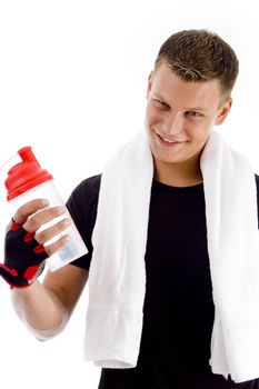smiling muscular man with water bottle on an isolated background
