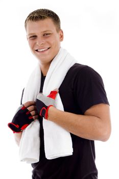 smiling adult man holding towel against white background