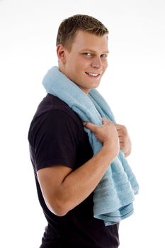 side view of handsome male holding towel with white background