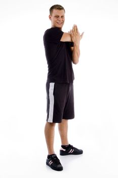 standing male stretching on an isolated background