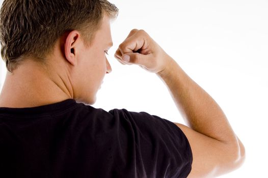 back pose of muscular male showing muscles on an isolated white background