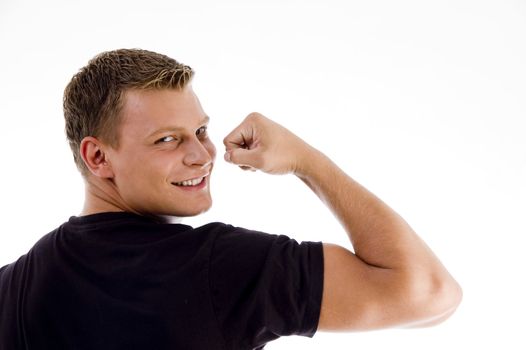 back pose of muscular man showing muscles on an isolated background