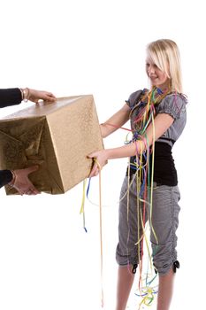 Pretty blond teenage girl with braces receiving a present