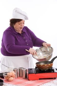 Woman busy cooking in the kitchen