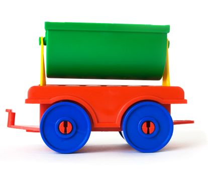 Toy colored plastic carriage on the white background