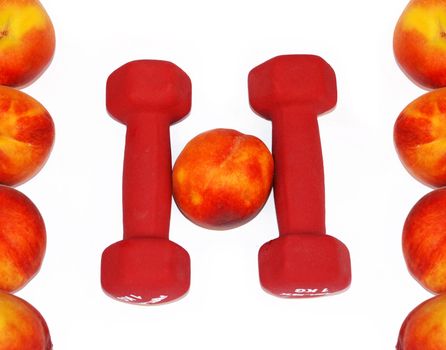 appetizing fresh peaches and dumbbells in shape H letter