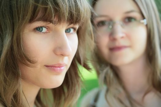 close-up portrait of the two young and beautiful girls