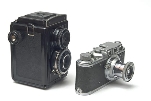two old photo cameras on white background