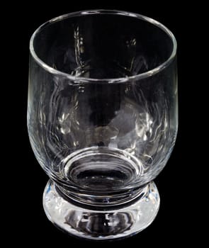 Glass empty goblet on the black background