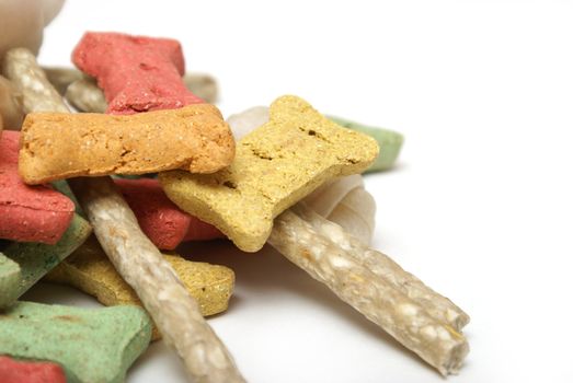 An isolated group of various dog treats.