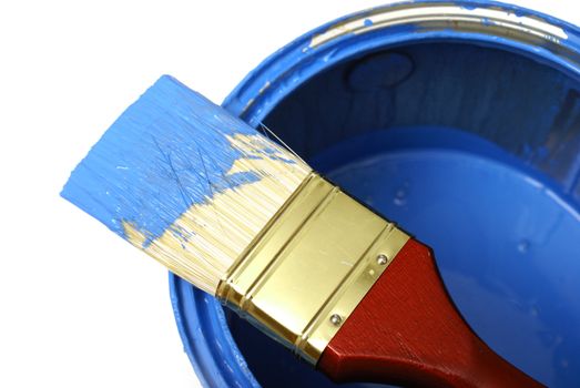 A paint brush and can with the colour blue.