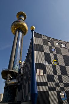 detail of the colorful community heating plant designed by Hundertwasser in Vienna