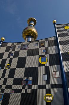 detail of the colorful community heating plant designed by Hundertwasser in Vienna