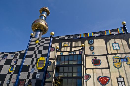 detail of the colorful community heating plant designed by Hundertwasser in Vienna