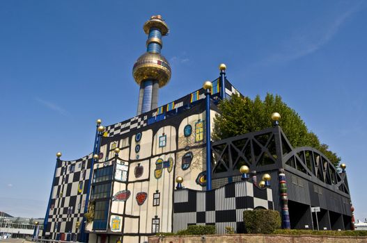 detail of the colorful community heating plant designed by Hundertwasser in Vienna