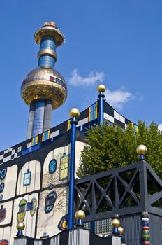 detail of the colorful community heating plant designed by Hundertwasser in Vienna