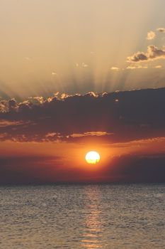 Sunset over the calm waters of the Adriatic sea, seen from Croatia towards Italy