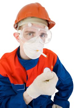 Man in respirator with cigarette and with lighter in hand