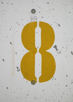 number 8 yellow sign