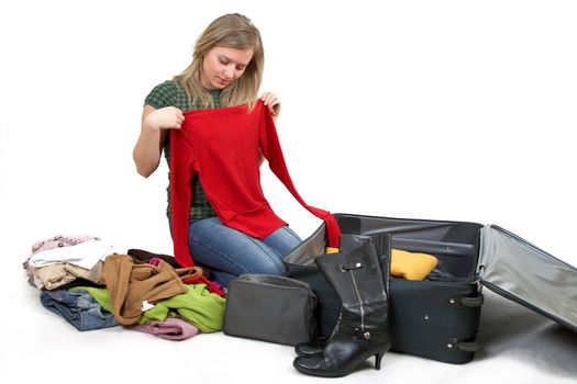 girl is packing clothes, separate on white