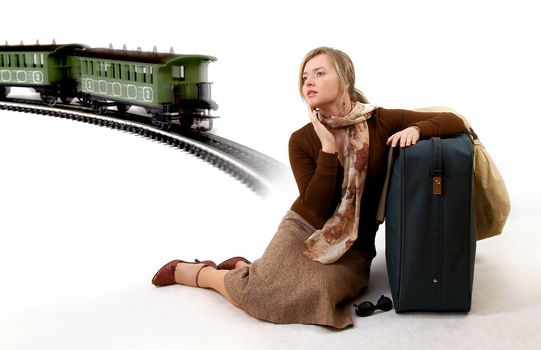 woman with huge bag is waiting for train