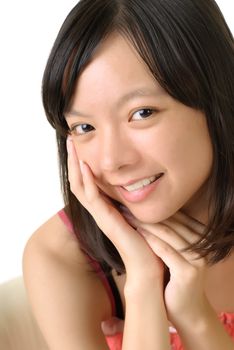 Portrait of beautiful woman with smiling expression and hand touch on face.